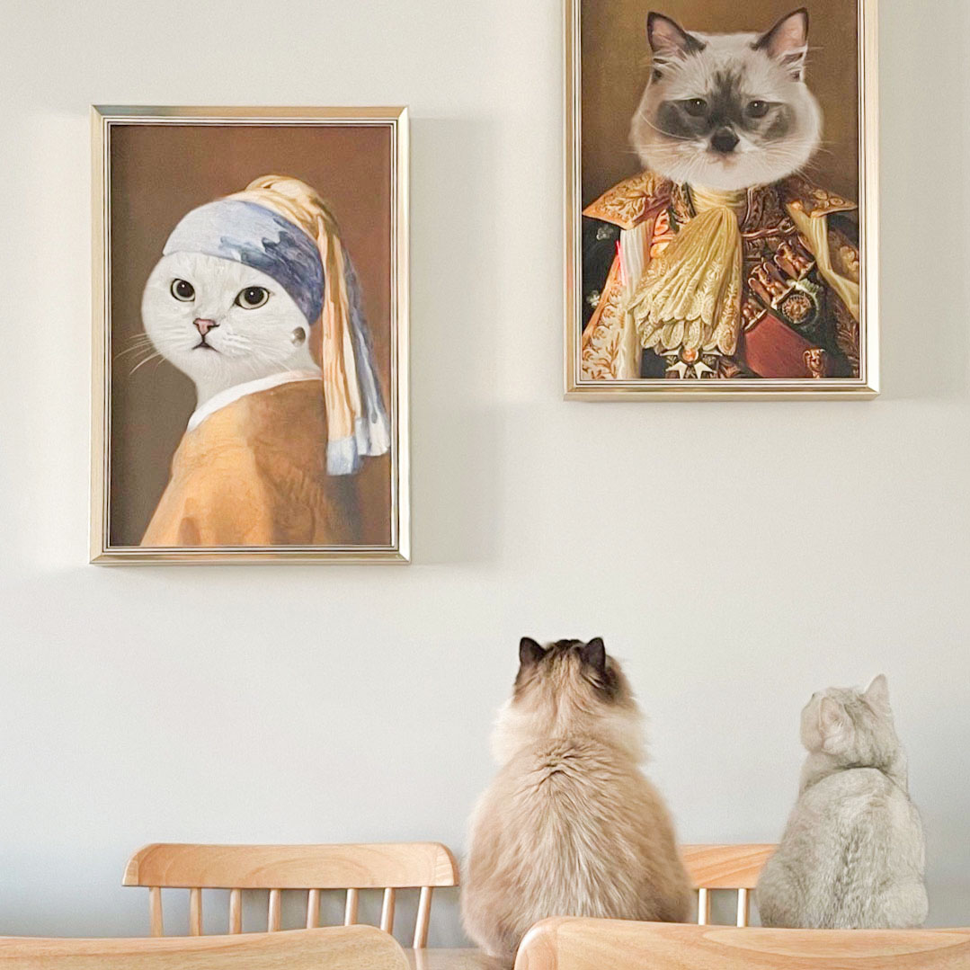 Two cats and their framed royal portrait art
